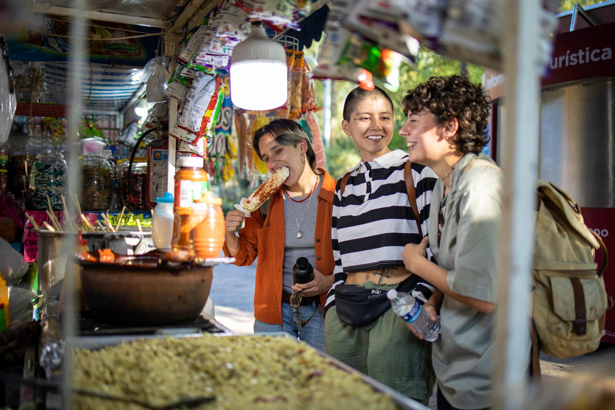 Travelers exploring street food in Mexico